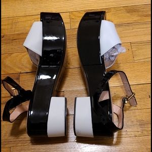 Robert Clergerie patent leather platform sandals.